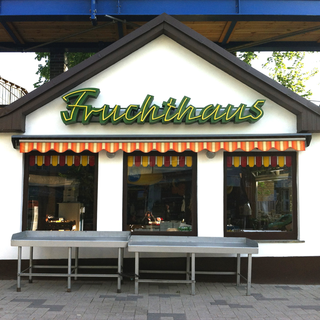 Lettering on sign on a fruit shop