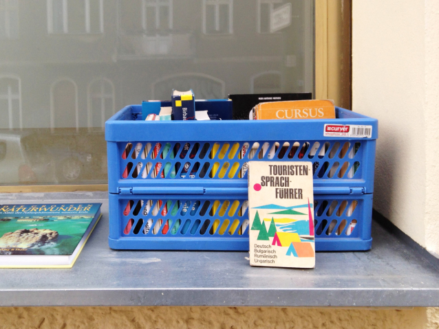 Crate of free books on a windowsill