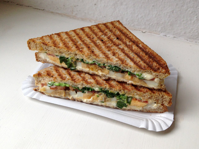 Grilled sandwich with bear's garlic on paper tray