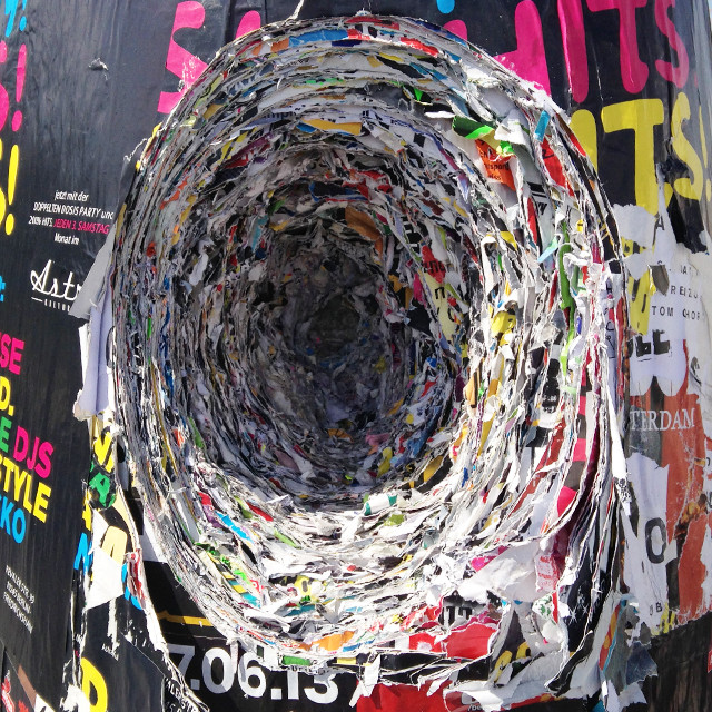 Deep hole cut in thick stack of paper