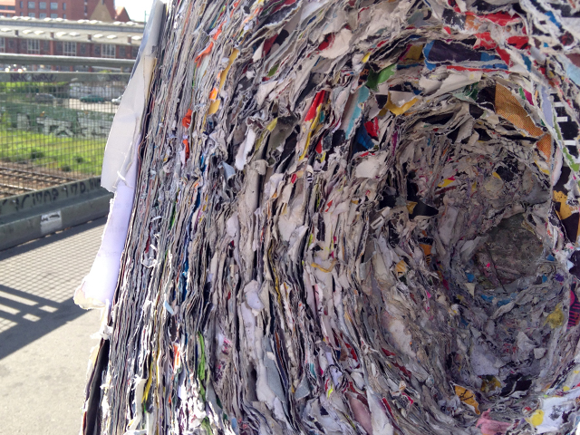 Close up of many layers of ragged-edged paper