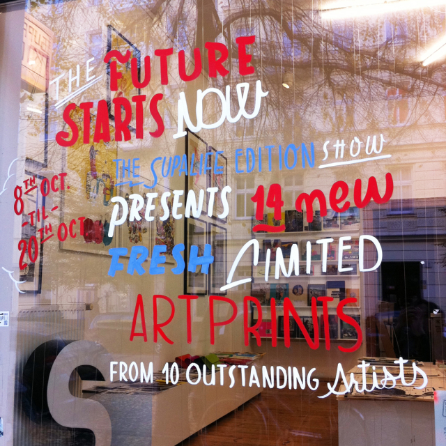 Hand painted window lettering at a gallery